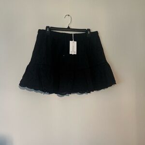 Ghanda Black Mini Skater Skirt with Ruffled Tiered Design